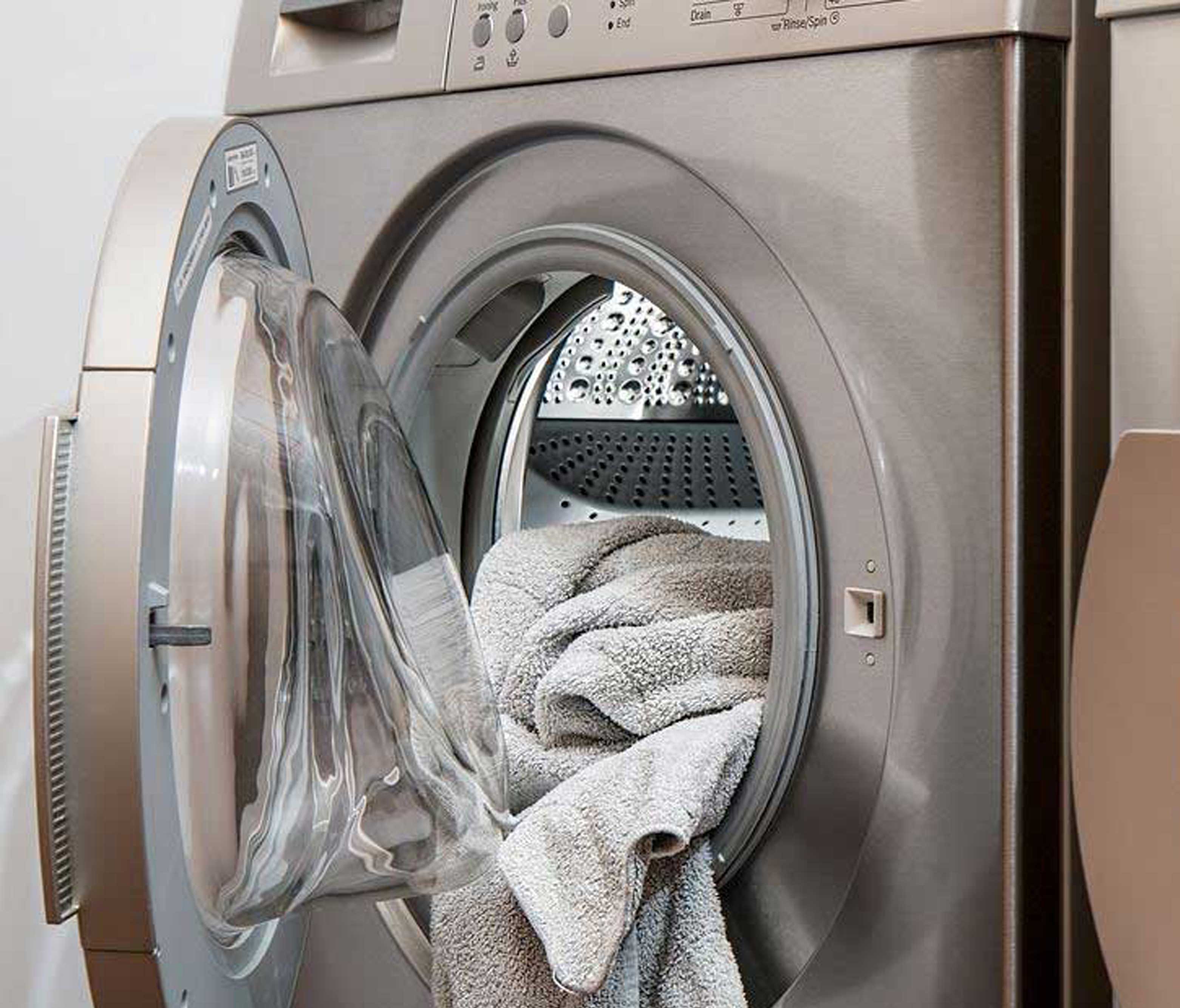 washing machine with a towel coming out