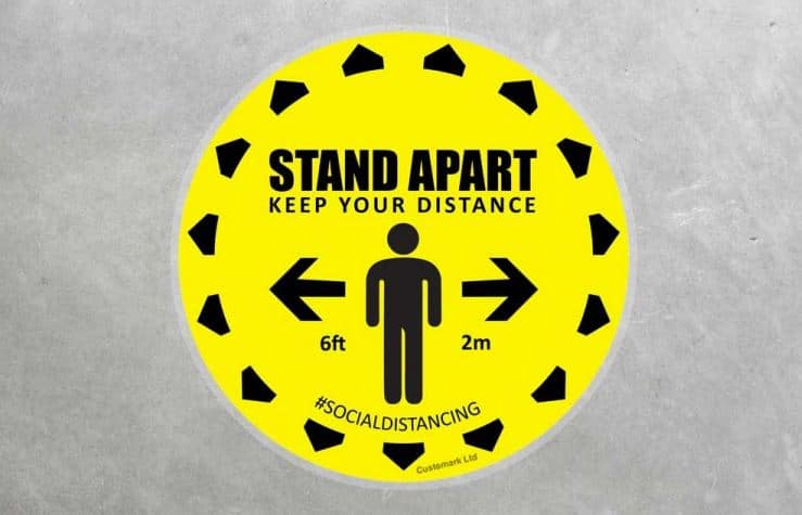 standing 2m apart social distancing floor sticker in yellow